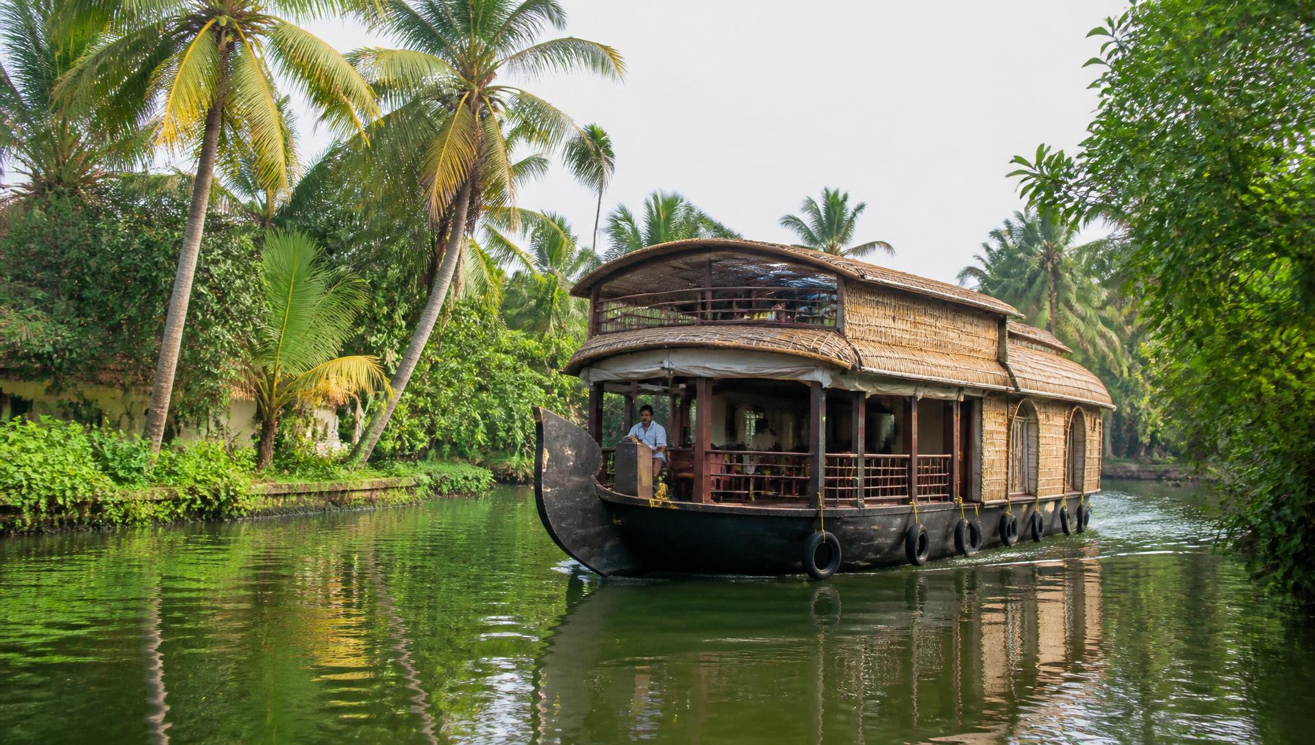 Kerala backwaters houseboat at golden hour