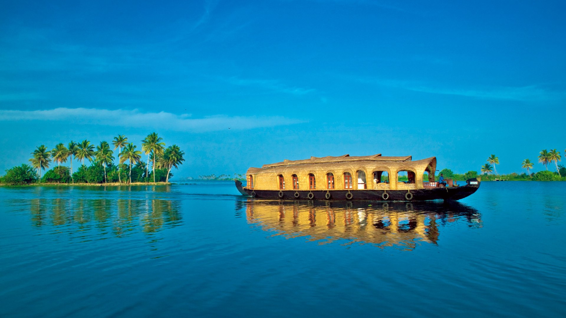 Kerala backwaters houseboat at golden hour