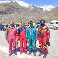 Travellers in snow suits at Rohtang Pass